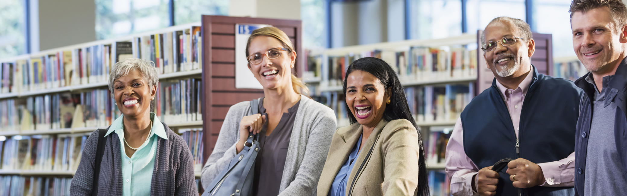 People smiling in library