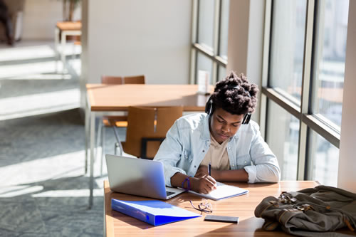 Student studying at library