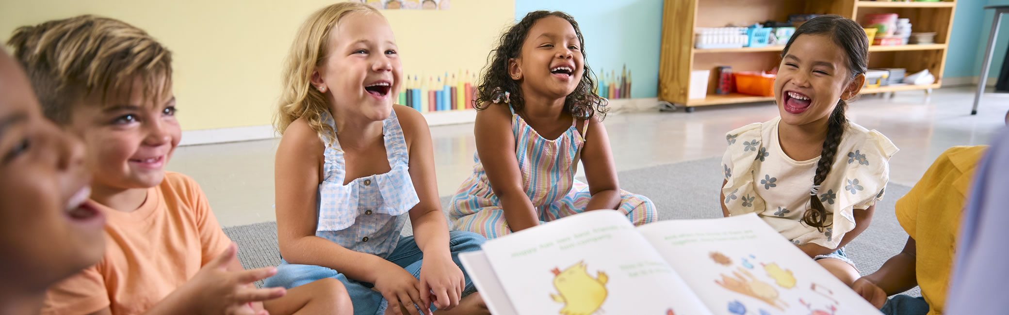 Group of children laughing in library